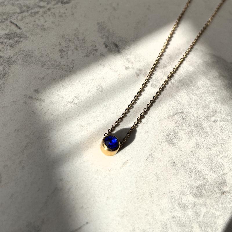 blue saphire september birthstone necklace in sunlight