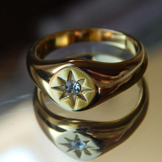 gold signet ring with star